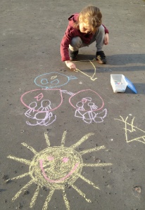 child painting with chalk